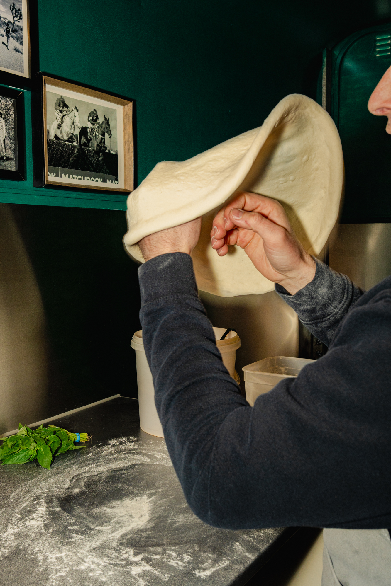 Tossing pizza dough by hand