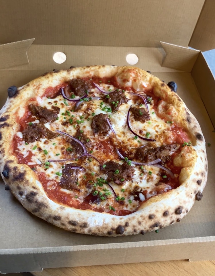 Beef and red onion pizza