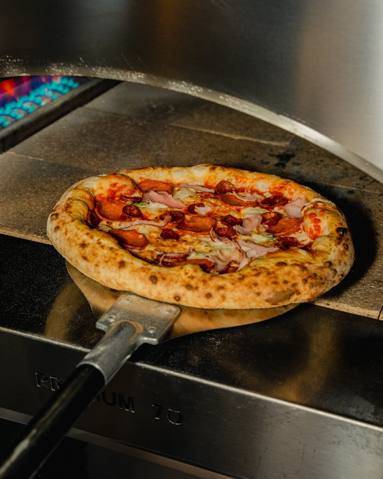 Pizza on a peel in the oven
