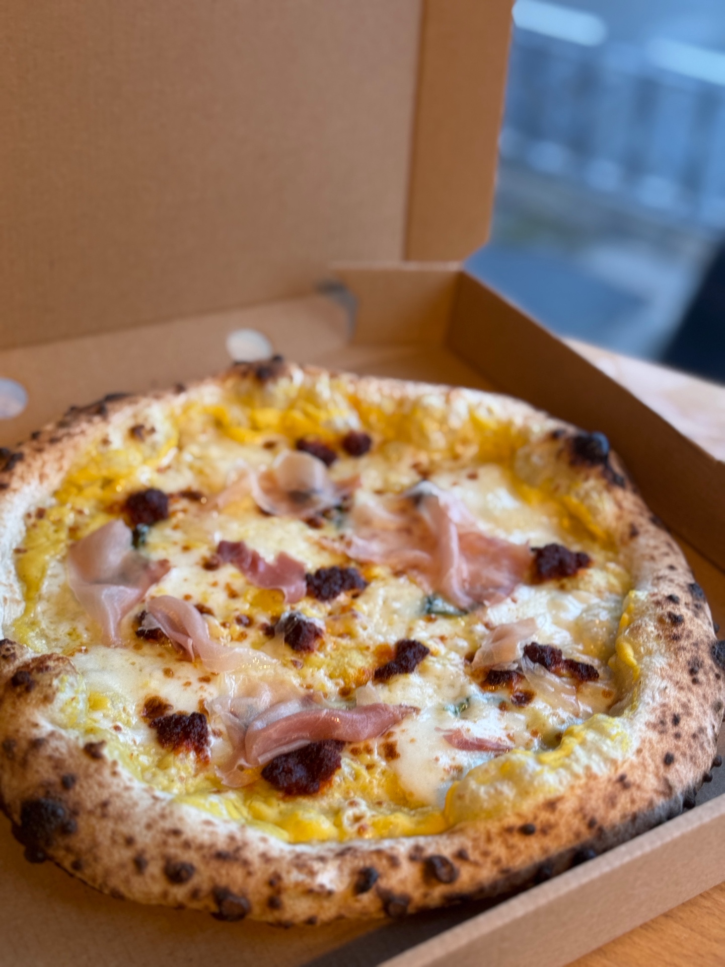 Prosciutto pizza with honey
