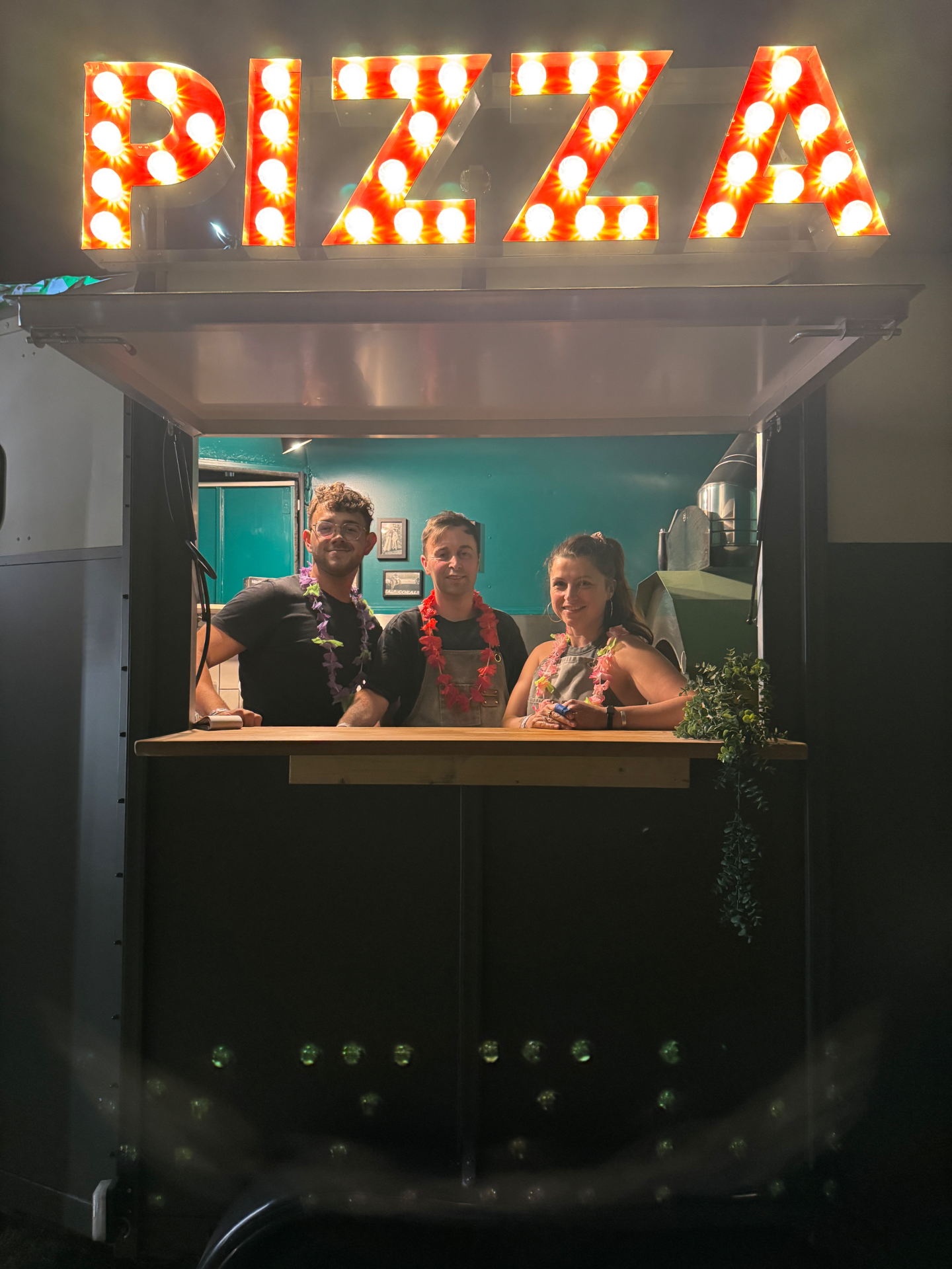 The team at the pizza trailer